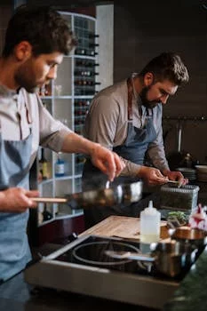 professional male chef in kitchen uniform